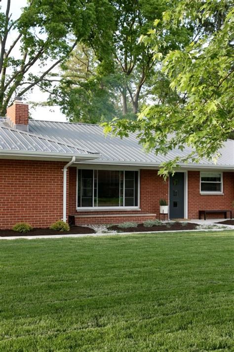 green metal roof on red brick house|metal roof on brick ranch.